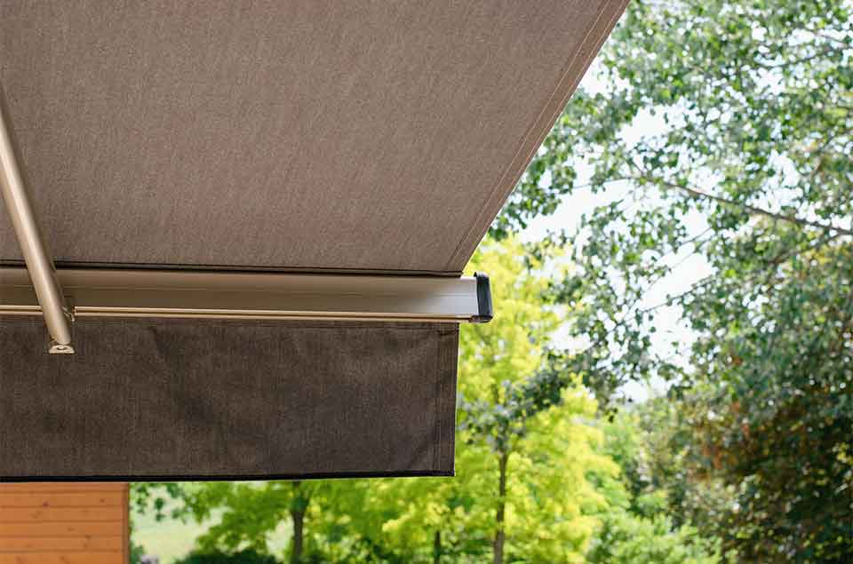 Retractable awning providing shade in a garden