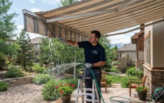 How to Clean a Fabric Awning - washing a fabric awning with soft brush and hose Denver
