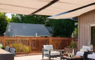 Shade canopy over a deck, providing sun protection, enhanced comfort, and aesthetic appeal while extending outdoor living space usability.