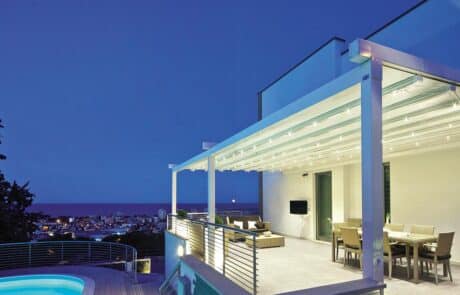 Modern terrace with ocean view at night