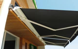 Outdoor high quality automatic sliding canopy retractable roof system, patio awning for sunshade of a modern wooden house.