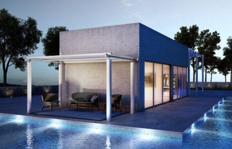 Modern house with patio and pool at dusk.